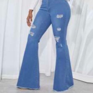 High Waisted Raw Hem Ripped
Flare Leg Jeans
Medium Wash / 6